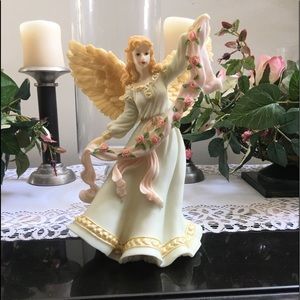 Collectable angel with flowered ribbon